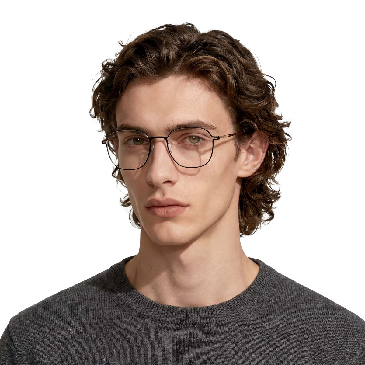 Man wearing glasses and a dark gray sweater on a white background
