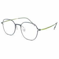 Eyeglasses with a green and gray frame on a white background
