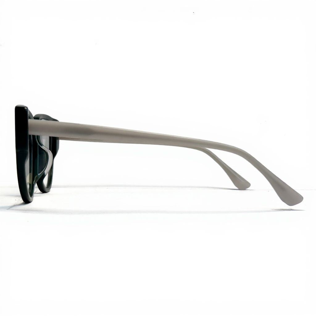 Sunglasses with a black frame and beige arms on a white background