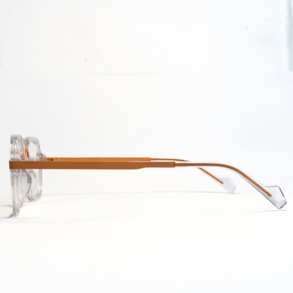 Eyeglasses with transparent arms and brown frame on a white background