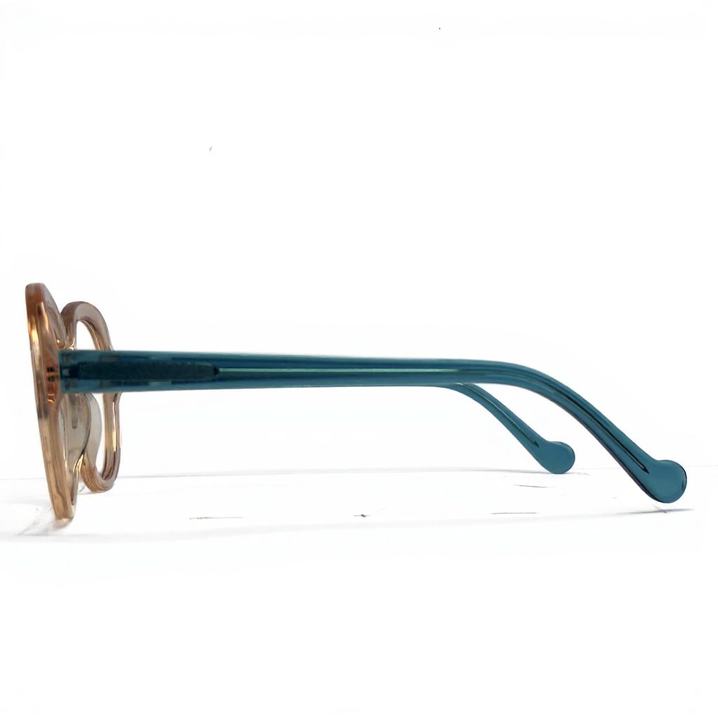 Teal eyeglasses with gold accents on a white background