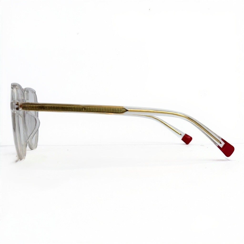 Sunglasses with gold frame and red accents on a white background