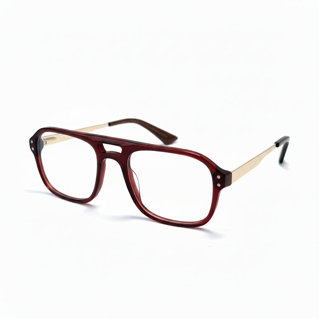 Brown eyeglasses with gold accents on a white background
