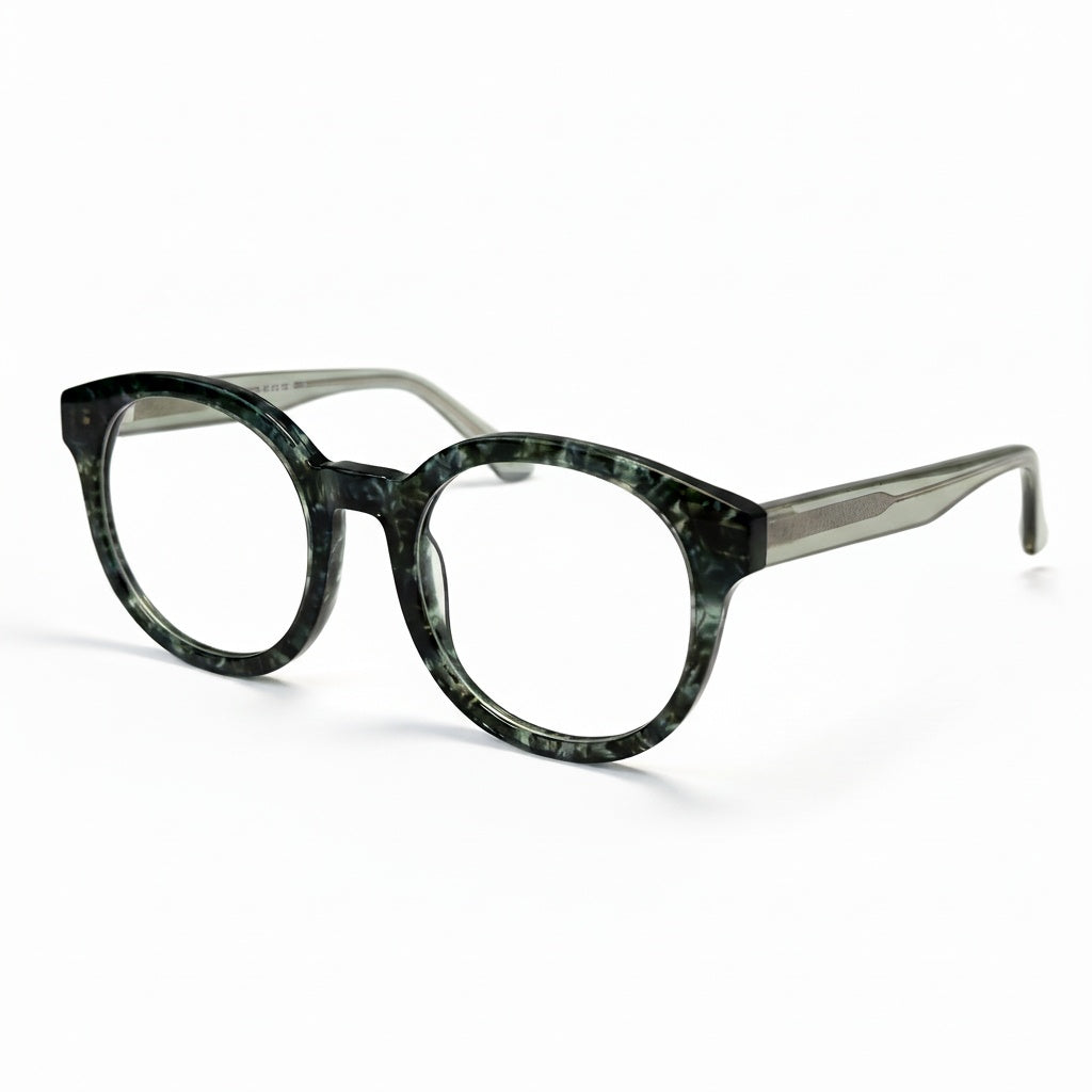 Green tortoiseshell eyeglasses on a white background