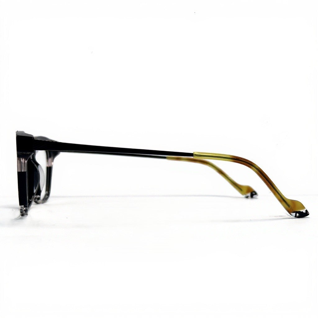 Eyeglasses with black and gold frame on a white background
