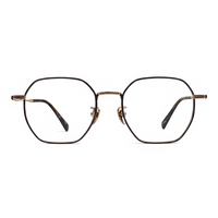 Pair of eyeglasses with gold frame and black lenses on a white background
