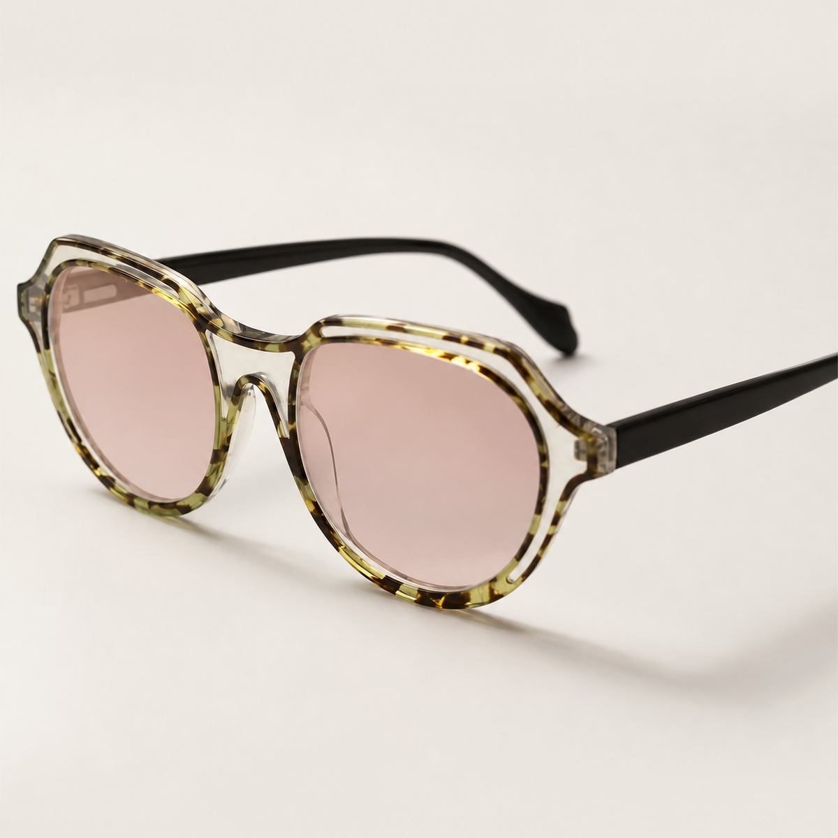 Featuring a classic round silhouette in light tortoiseshell acetate, finished...