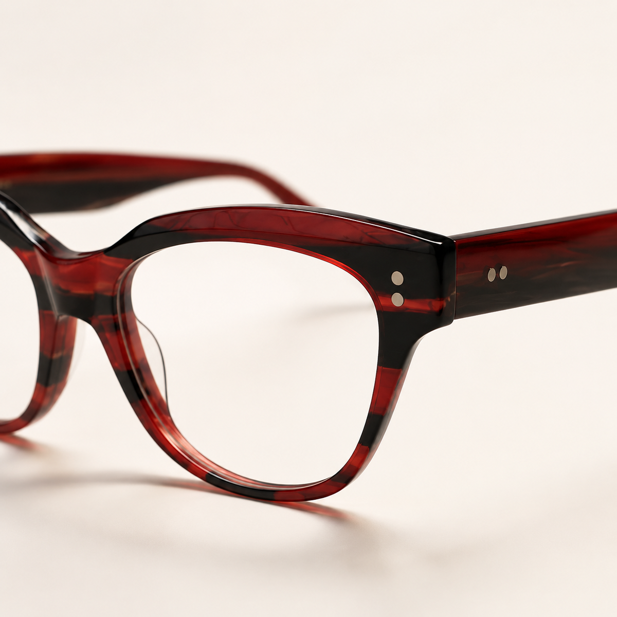 Featuring a classic cat-eye silhouette in black red acetate, finished...