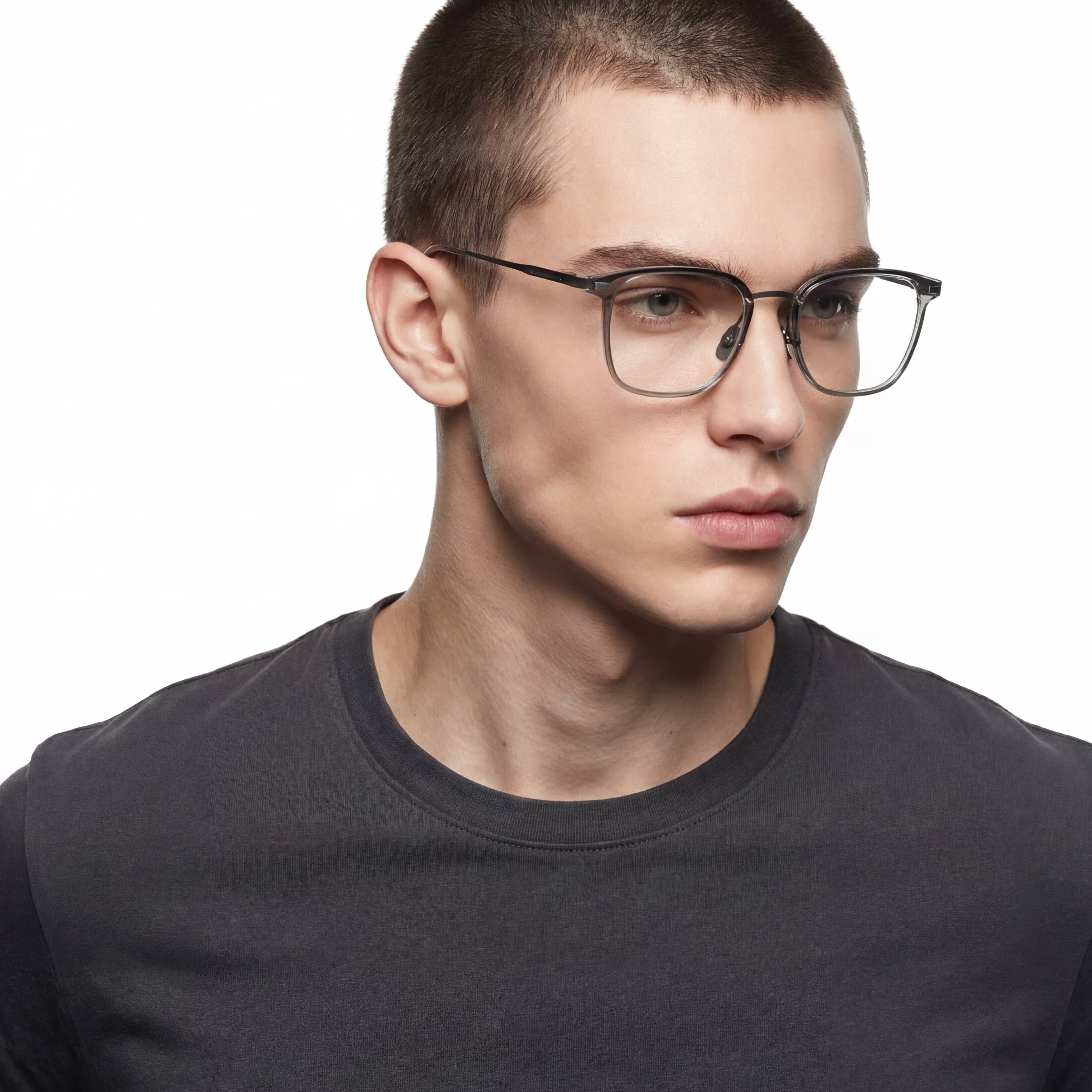 Man wearing glasses and a black shirt on a white background