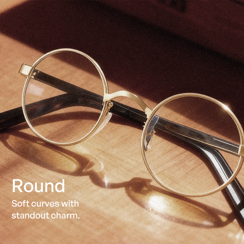 Gold round eyeglasses on a wooden surface with text describing their design.