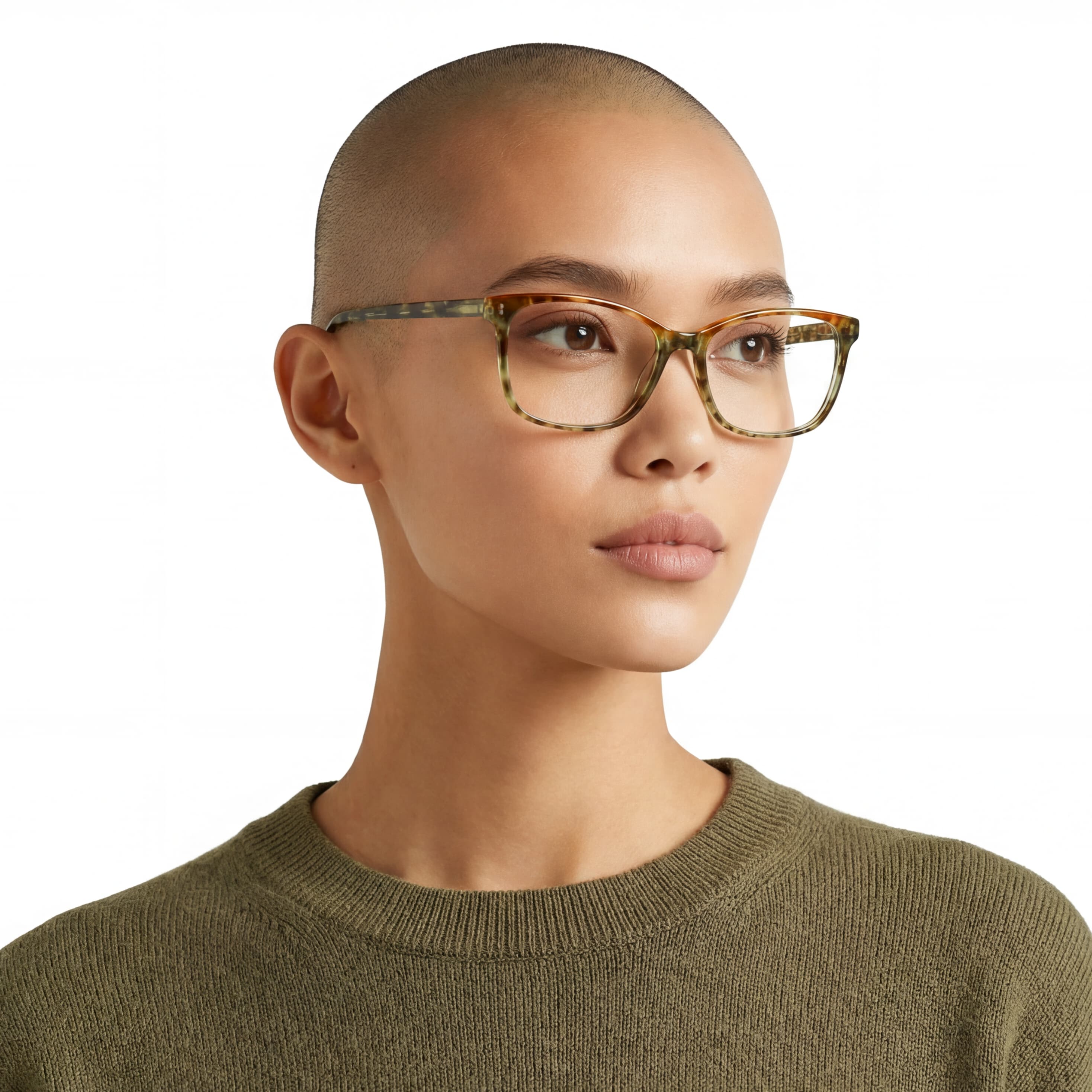 Person wearing tortoiseshell glasses and a green sweater on a white background
