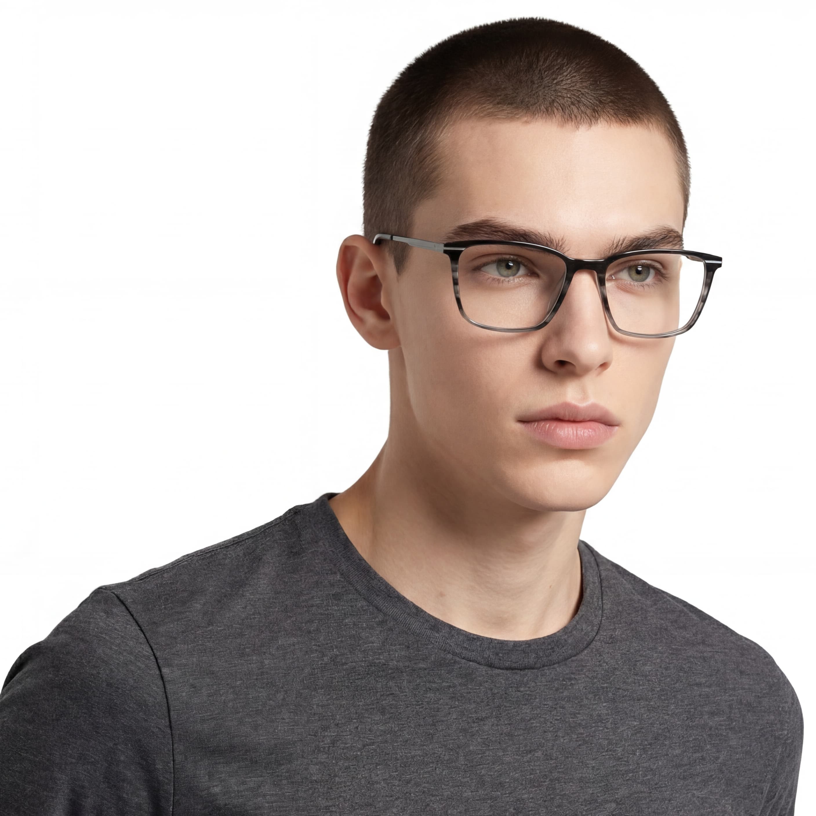 Person wearing glasses and a gray shirt on a white background