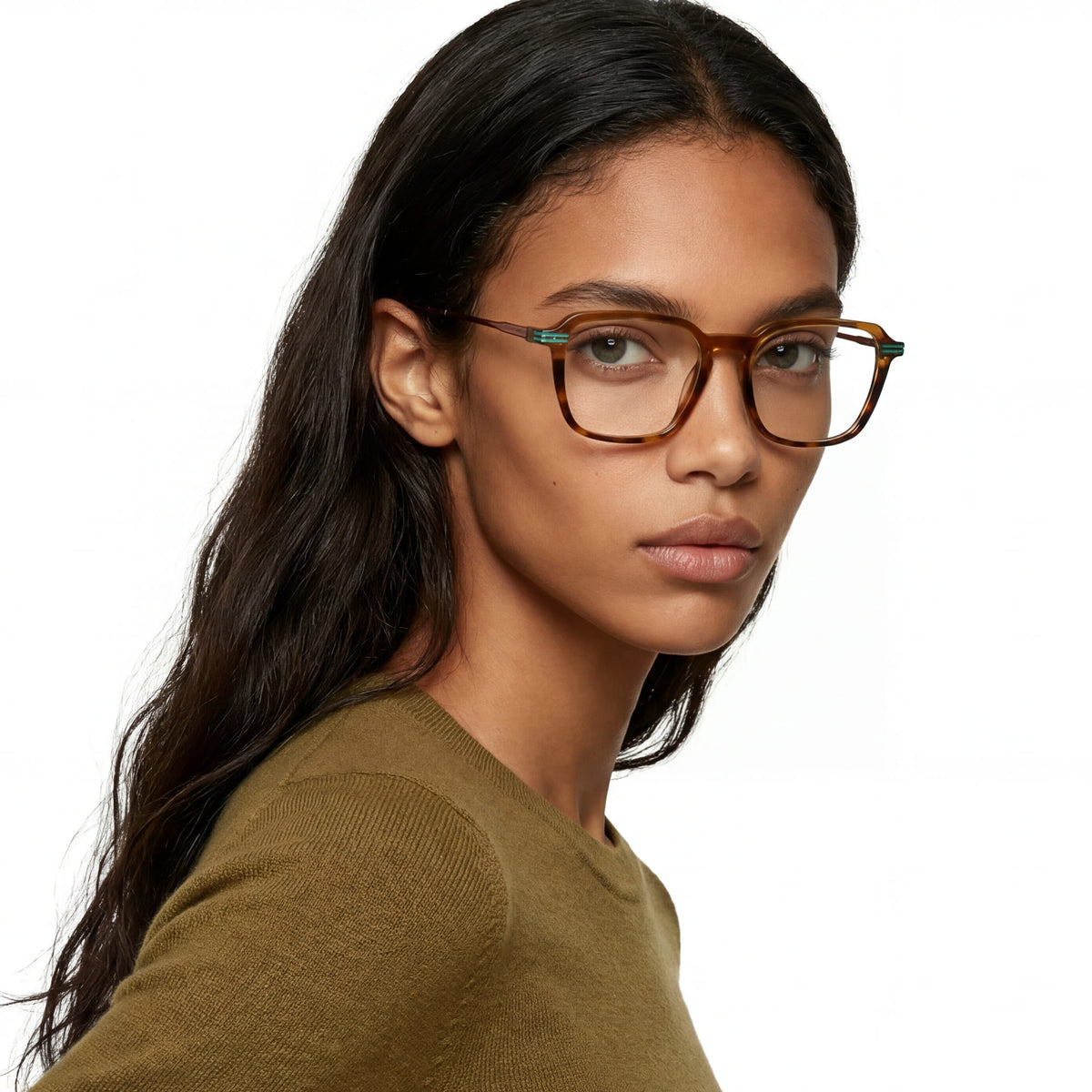 Woman wearing glasses with a neutral background
