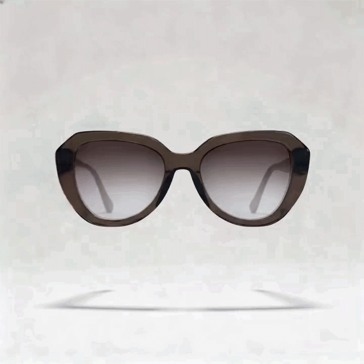Dark brown marbled cat-eye acetate sunglasses frame, side profile shot on light gray studio background
