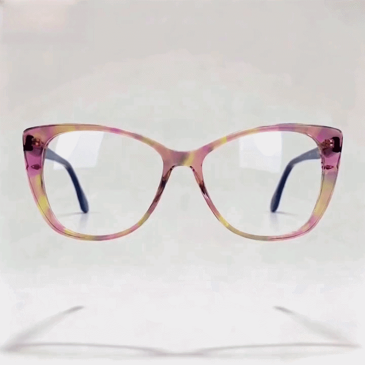 Pink yellow marbled cat-eye acetate eyeglasses frame, white studio background