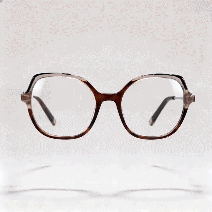 Brown marbled rounded square acetate eyeglasses frame with thin metal temple arms, light gray studio background
