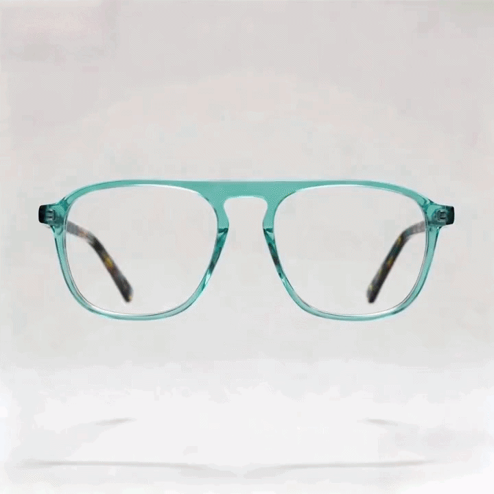 Transparent turquoise double bridge aviator acetate eyeglasses frame, tortoise temples, white studio background