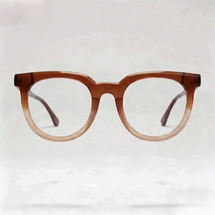 Gradient amber transparent acetate round eyeglasses frame, white studio background