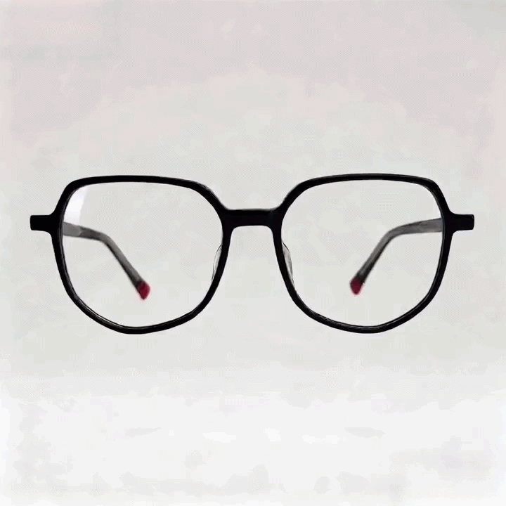 Black hexagonal acetate eyeglasses with red tip temple arms side studio shot