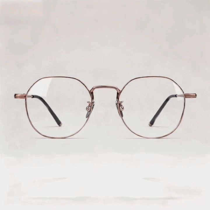 Rose gold metal octagonal eyeglasses frame, white studio background