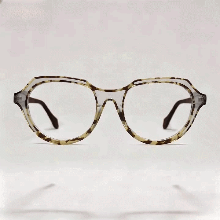 Pale tortoise octagonal acetate eyeglasses frame, dark solid temples, white studio background