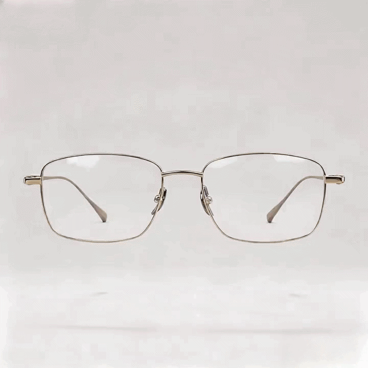 Gold metal square eyeglasses frame with burgundy temple tips, white studio background