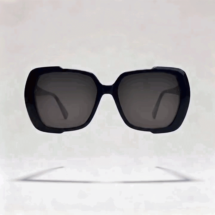 Black oversized square acetate sunglasses frame with dark gray tint lenses, light gray studio background