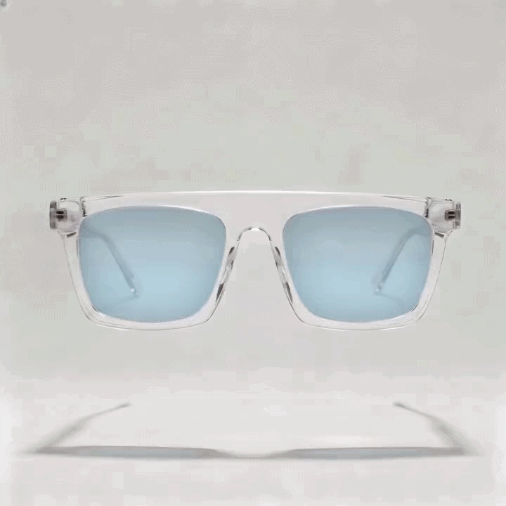 Transparent clear square acetate sunglasses frame with light blue tint lenses, white studio product shot