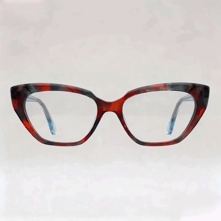 Red tortoise cat-eye acetate eyeglasses frame, white studio background