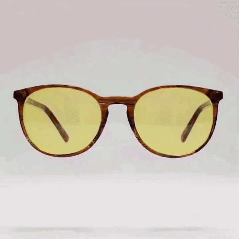 Tortoise round acetate sunglasses with yellow tint lenses studio shot