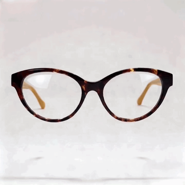 Tortoiseshell cat‑eye acetate optical frame, beige inner temple, white studio background