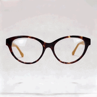 Tortoiseshell cat‑eye acetate optical frame, beige inner temple, white studio background