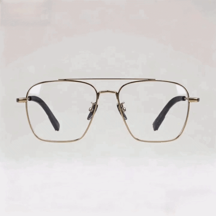 Gold double-bridge square metal eyeglasses frame, light gray studio background