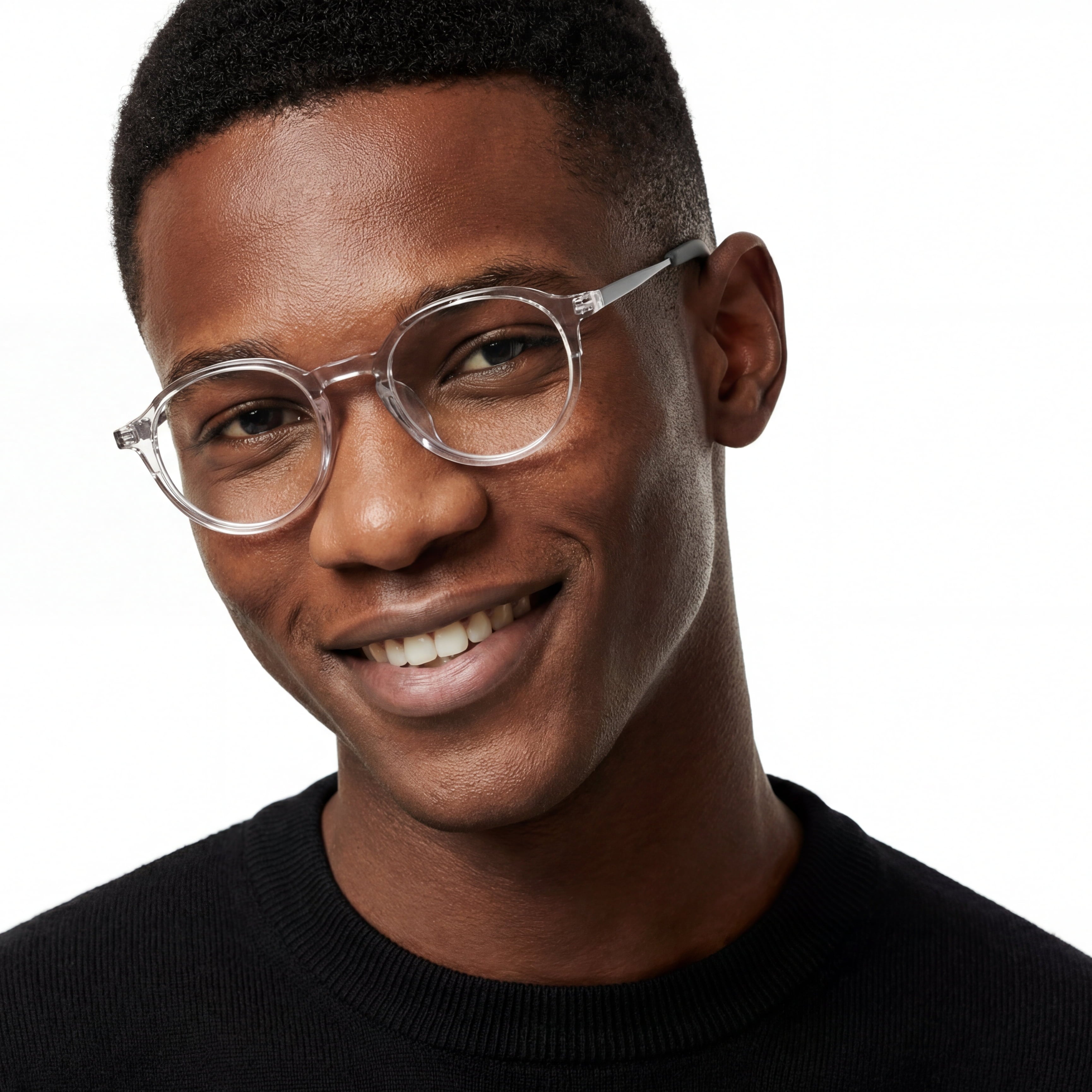 Man wearing clear eyeglasses with a black background