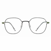 Round eyeglasses with green accents on a white background